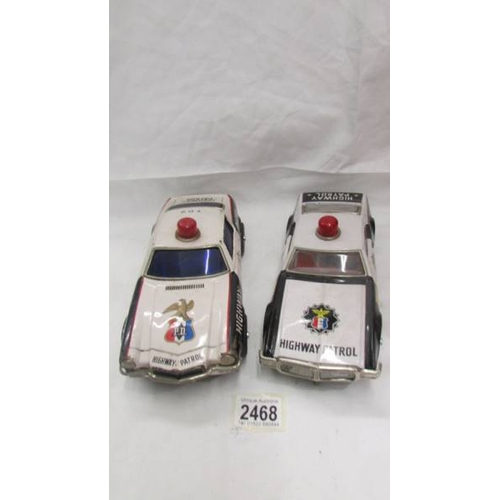 2468 - Two large tin plate battery operated American police cars - Trans-Am and Tornado.