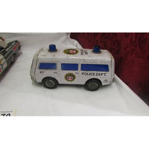 2470 - An 'ASC' Japan tinplate friction police car with siren, a Japanese police van and an un-named Bedfor... 