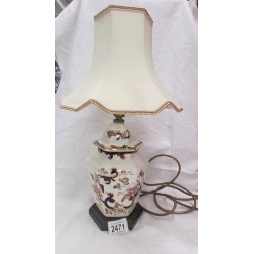 2471 - An oriental style table lamp with shade.