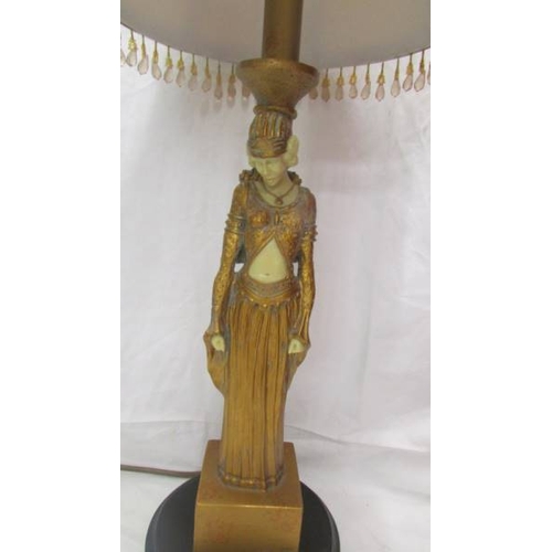 2472 - An art deco style figural table lamp with shade.