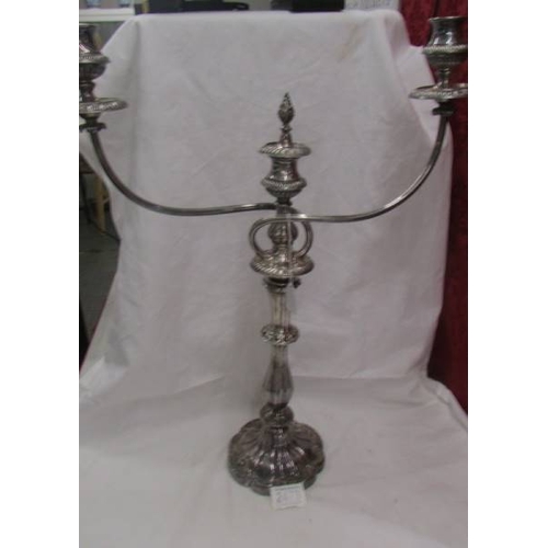 2473 - A large silver plate candelabra.