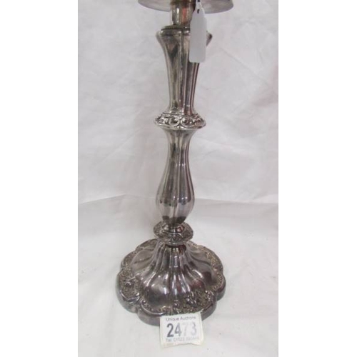 2473 - A large silver plate candelabra.