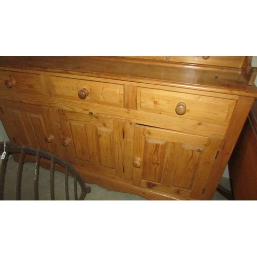 2485 - A good 3 door pine dresser. (collect only)