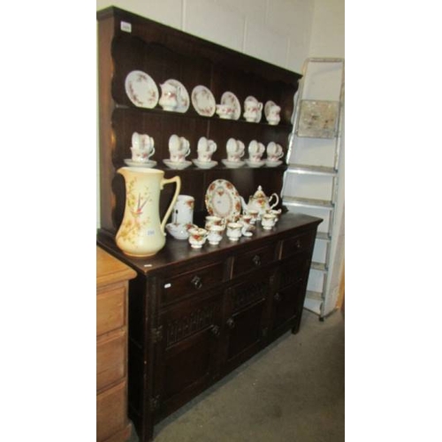 2499 - A three door oak dresser. (collect only)