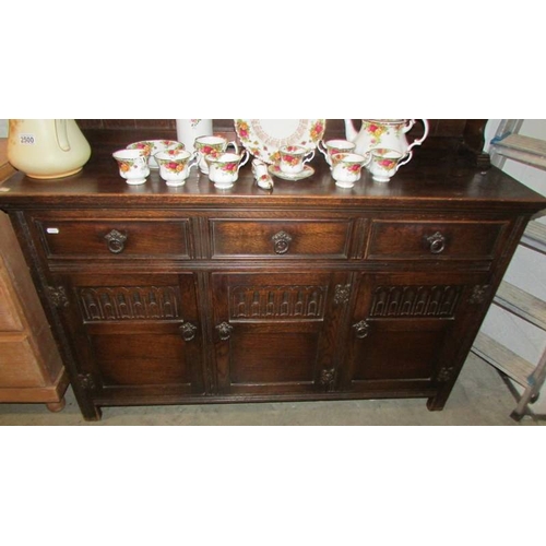 2499 - A three door oak dresser. (collect only)