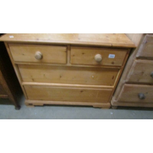 2505 - A two over two chest of drawers, missing four knobs. (collect only)