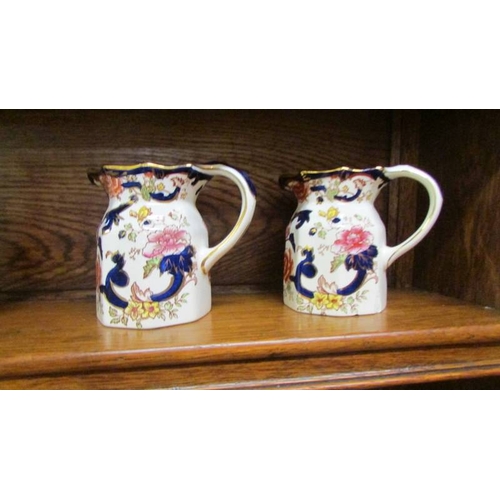 2506 - Three Mason's ironstone jugs, pair of vases, 2 clocks, 3 plates and 2 other items.