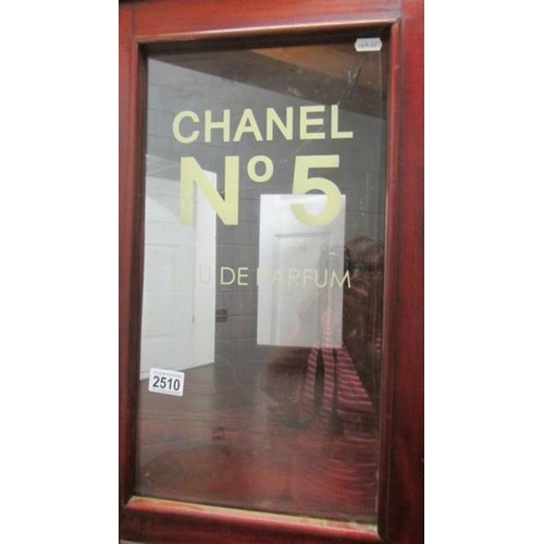 2510 - An octagonal display cabinet sign written of Chanel No. 5. (collect only)