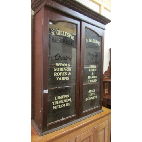 2515 - A sign written haberdashery cabinet. (collect only)