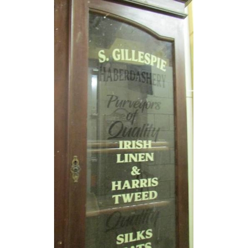 2515 - A sign written haberdashery cabinet. (collect only)