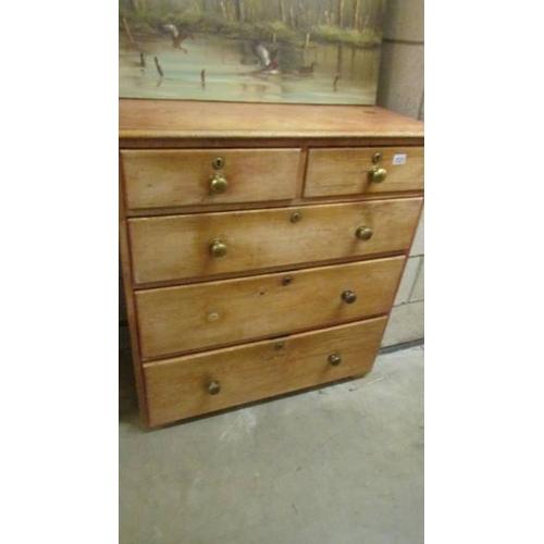 2525 - A two over three pine chest of drawers, missing one knob. (collect only)