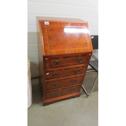 2529 - A small modern mahogany inlaid bureau. (collect only)