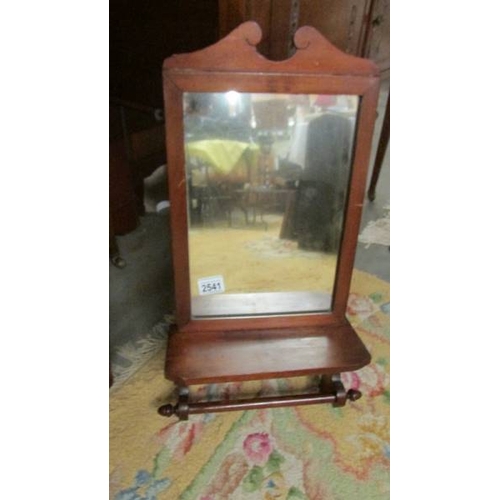 2541 - A mahogany framed mirror with towel rail. (collect only)