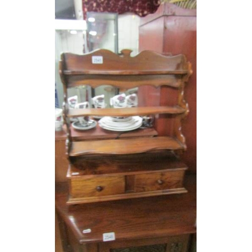 2545 - A mahogany shelf with two drawers. (collect only)