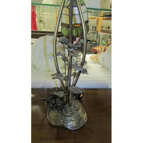 2561 - A three light table lamp with Tiffany style shades. (collect only)