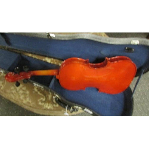 2569 - A cased violin.