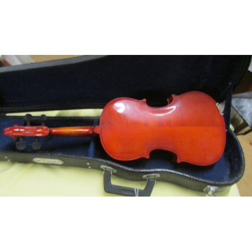 2573 - A small cased violin.