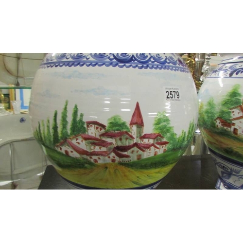 2579 - Two large hand painted pots. (collect only)