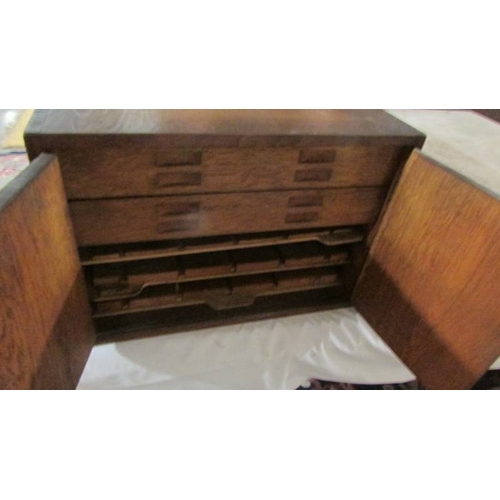 2629 - An early 20th century oak insect specimen cabinet (contents in poor condition). (collect only)