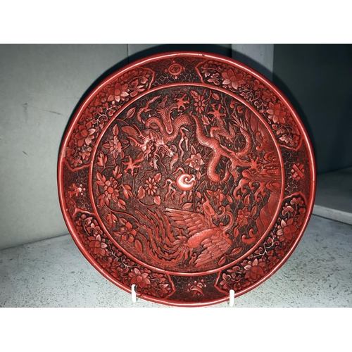 1109 - A Cinnabar plate, a pot featuring dragon design & a statue of a Buddha (small chip to hand)