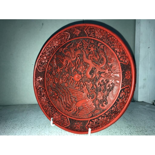 1109 - A Cinnabar plate, a pot featuring dragon design & a statue of a Buddha (small chip to hand)