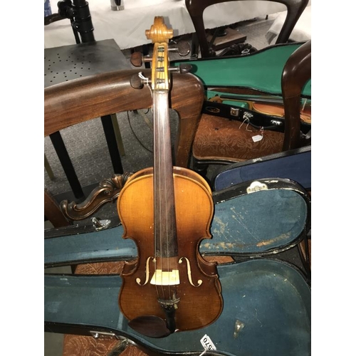 2570 - An old violin in hard case.