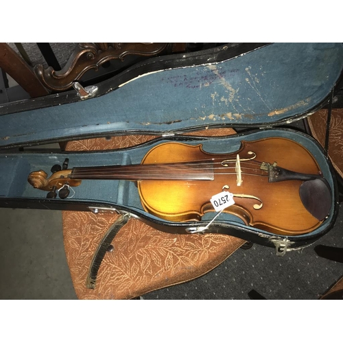 2570 - An old violin in hard case.