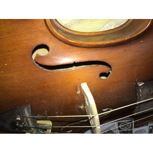 2570 - An old violin in hard case.