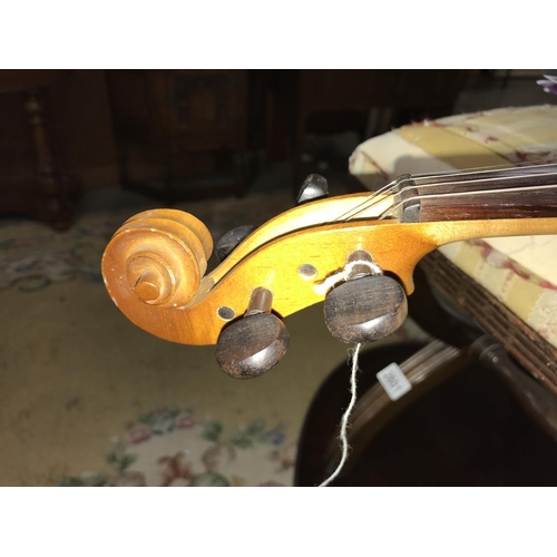 2570 - An old violin in hard case.