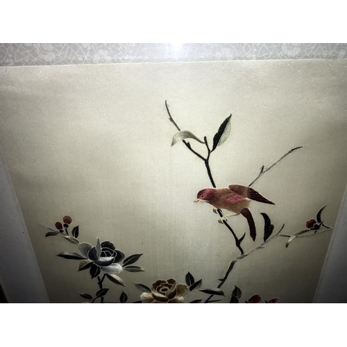 450 - A framed and glazed embroidery of a bird. (collect only)