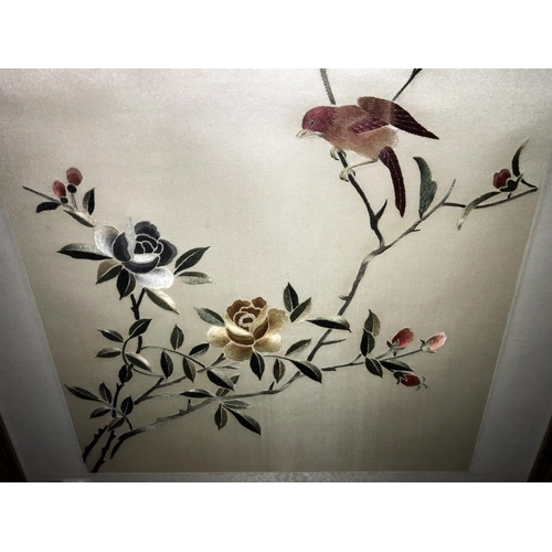 450 - A framed and glazed embroidery of a bird. (collect only)