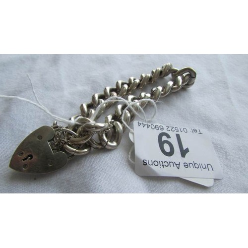 19 - A silver bracelet with padlock.