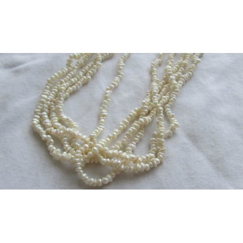 38 - A five strand natural pearl necklace.