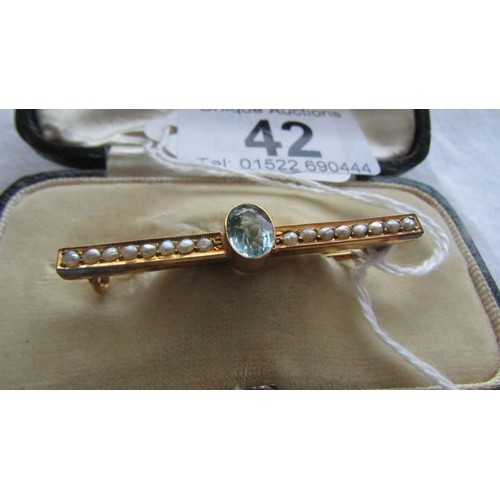 42 - A 9ct gold brooch set aquamarine and seed pearls.