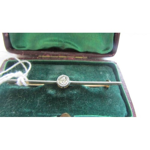 45 - A gold bar brooch set diamond,