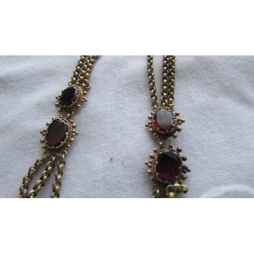 53 - An Victorian gold necklace set rubies and seed pearls.