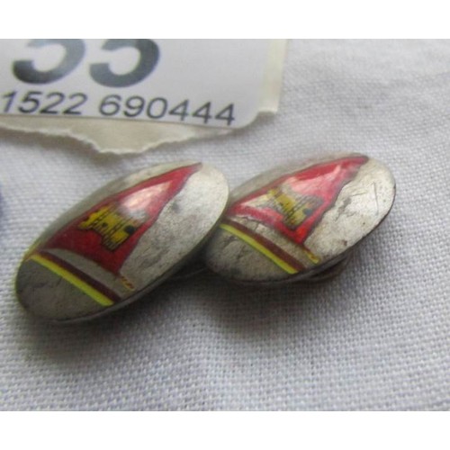 55 - A pair of silver 'pennant' cuff links.