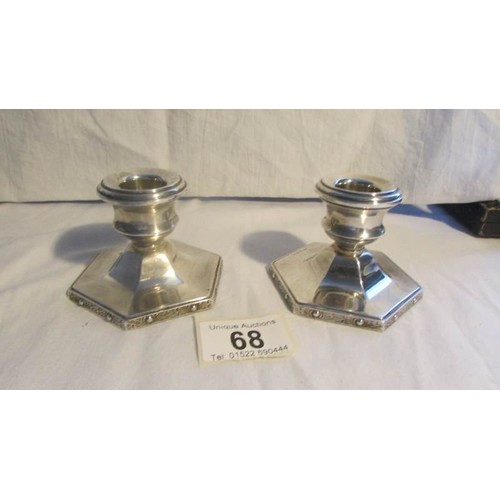 68 - A pair of Turner Simpson silver candlesticks.