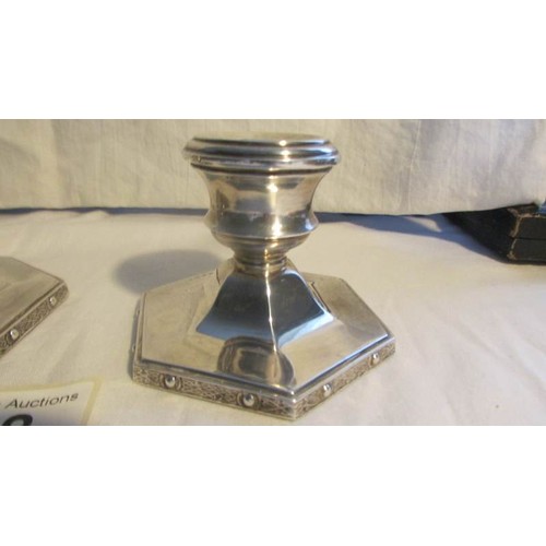 68 - A pair of Turner Simpson silver candlesticks.