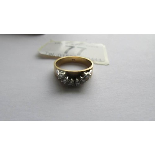 77 - An 18ct gold ring set six diamonds, size J half.