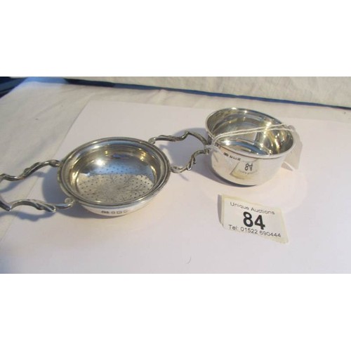 84 - A silver tea strainer.