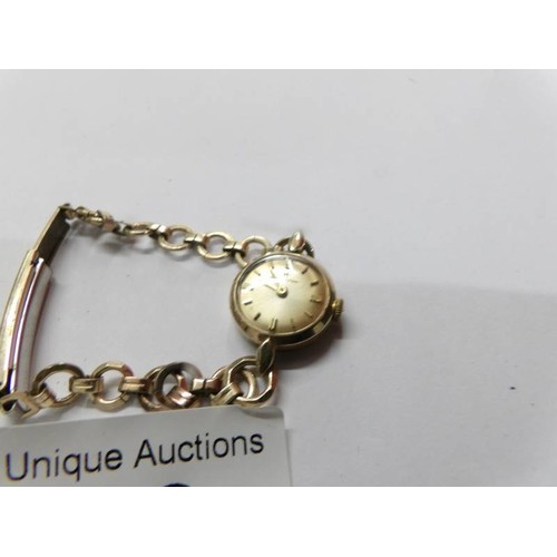 78 - A Hamilton 9ct gold cased ladies wrist watch on rolled gold strap, in working order.