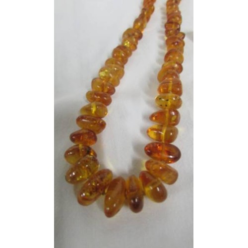 97 - An amber necklace.