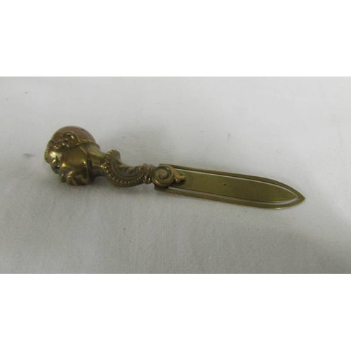 171 - A small banded agate weight. a gilt metal clip with figural handle with agate inset head, a hardston... 