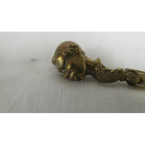 171 - A small banded agate weight. a gilt metal clip with figural handle with agate inset head, a hardston... 