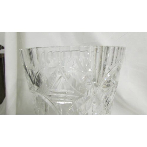 210 - A heavy cut glass vase, 23cm tall, 8.5 cm diameter at top.