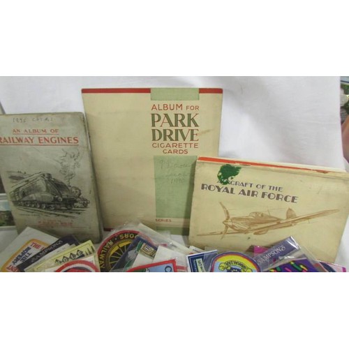 226 - A good selection of tourist souvenir cloth patch badge and a quantity of cigarette card albums.