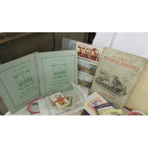 226 - A good selection of tourist souvenir cloth patch badge and a quantity of cigarette card albums.