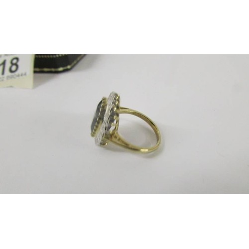 118 - A large sapphire and diamond yellow gold ring, size M.