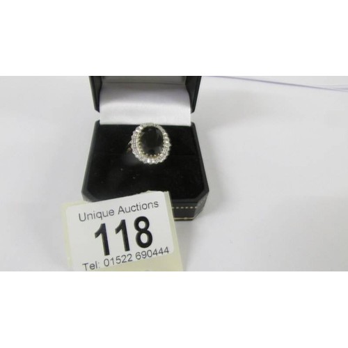 118 - A large sapphire and diamond yellow gold ring, size M.